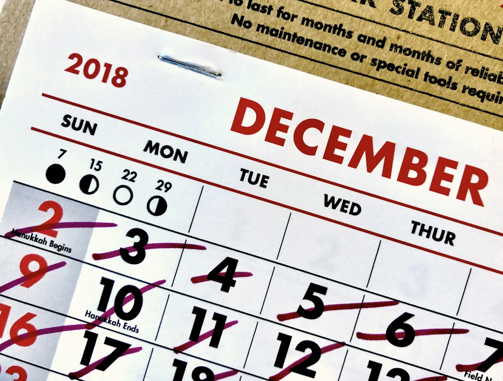 A December calendar page with the days crossed out