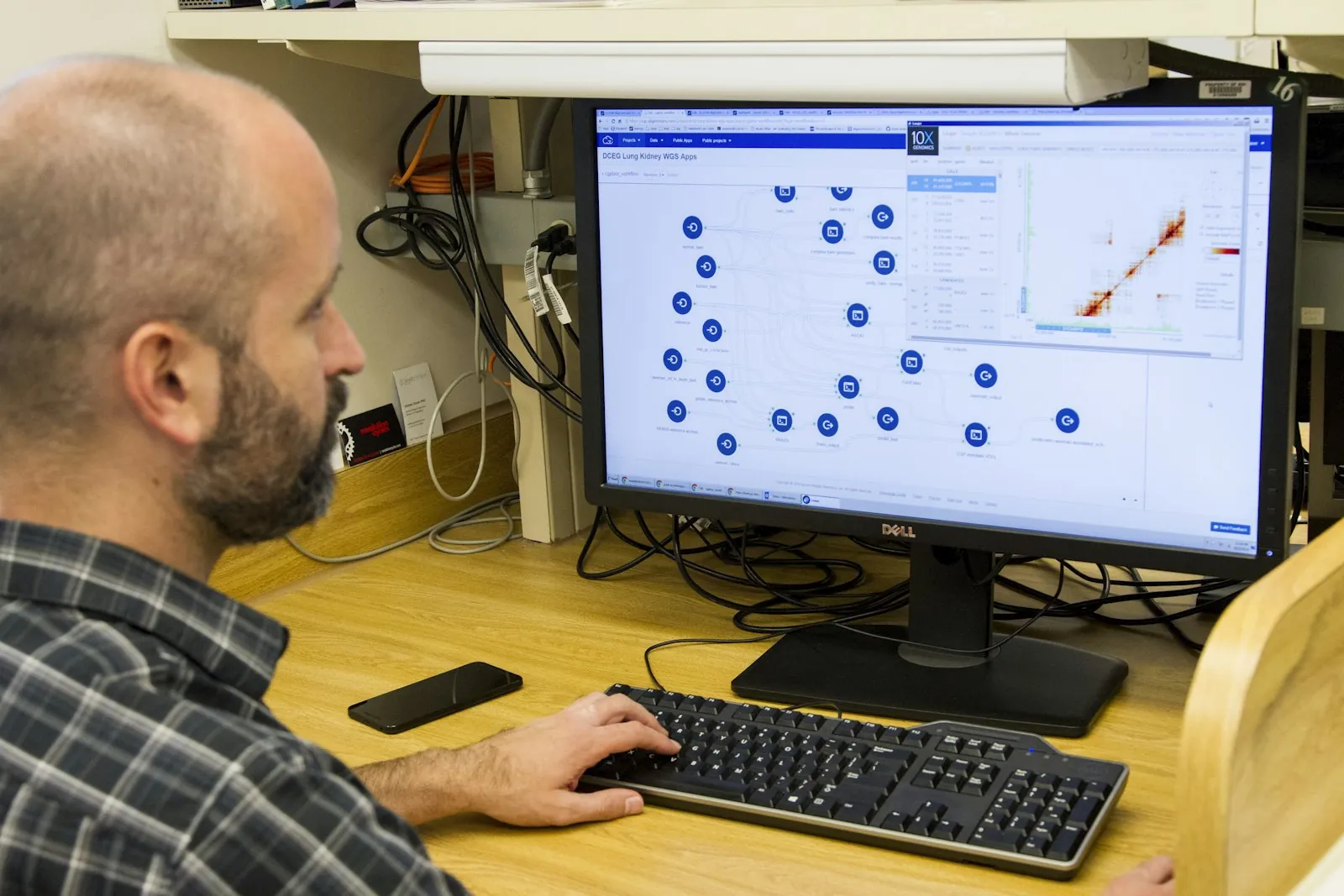 A scientist at the National Cancer Institute studies DNA data on a computer