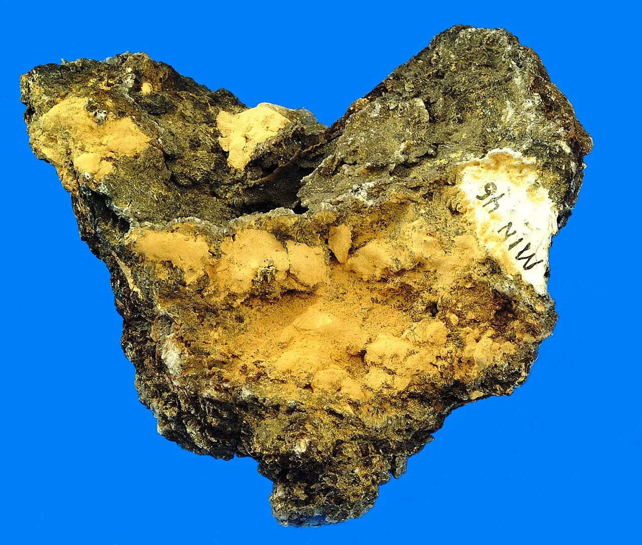 A rock coated with bright yellow sulfur