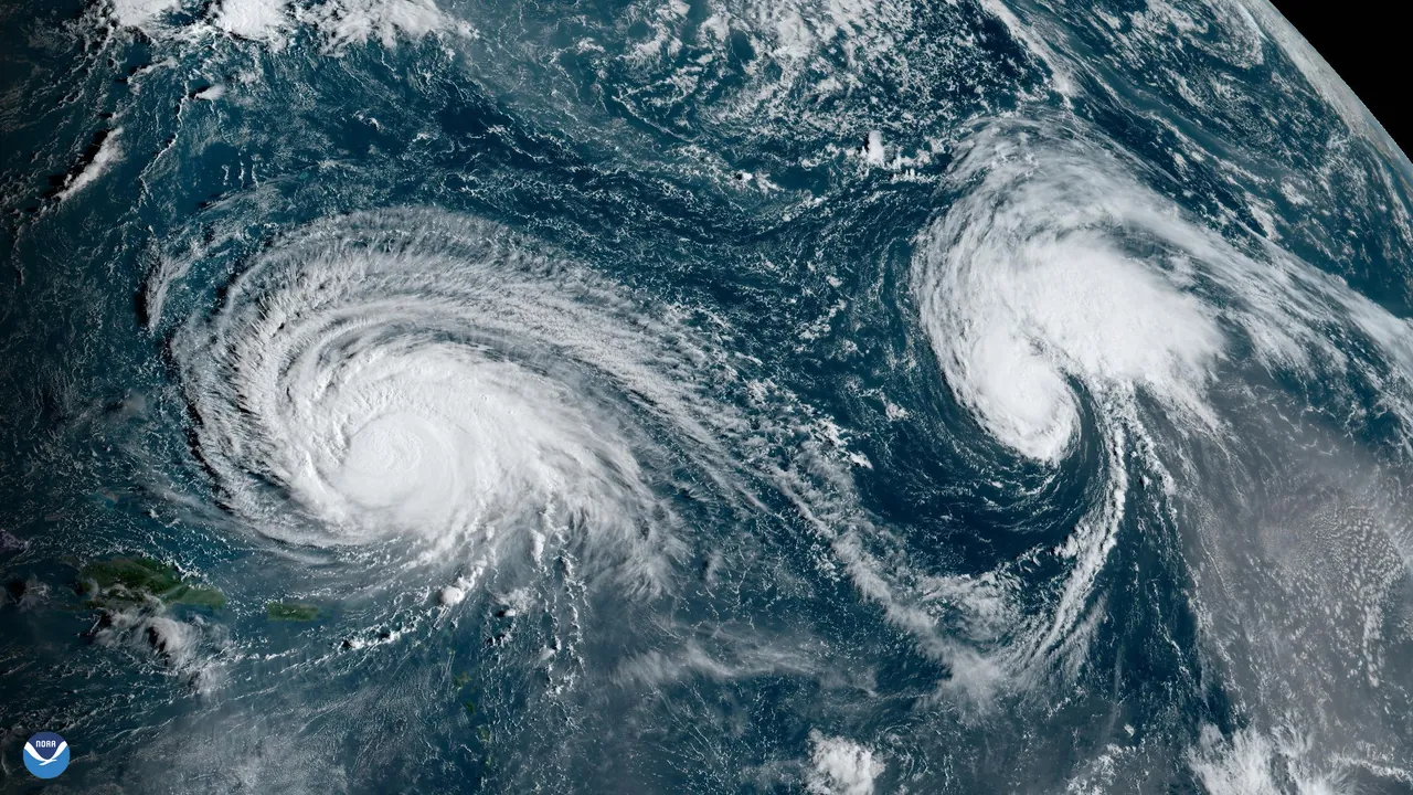 A GOES weather satellite image of Hurricane Lee and Tropical Storm Margot over the Atlantic Ocean