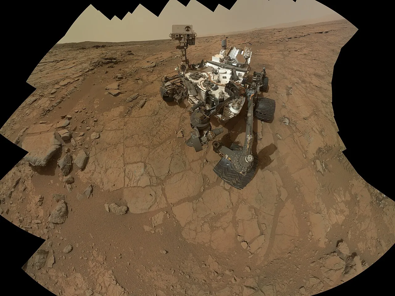 NASA’s Curiosity rover on the rocky red ground of Mars, in a self-portrait made from many pictures