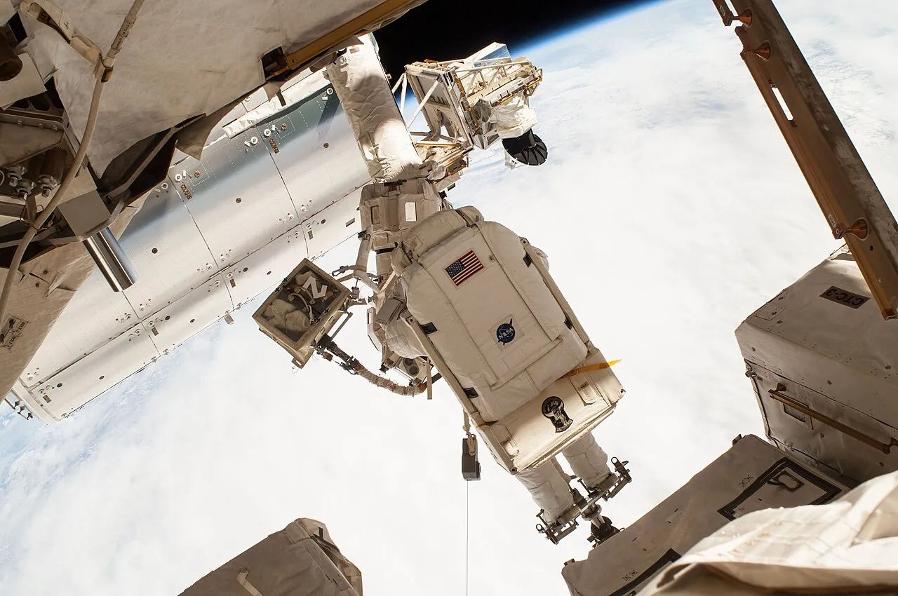 NASA astronaut Terry Virts on a spacewalk outside the space station, with Earth below