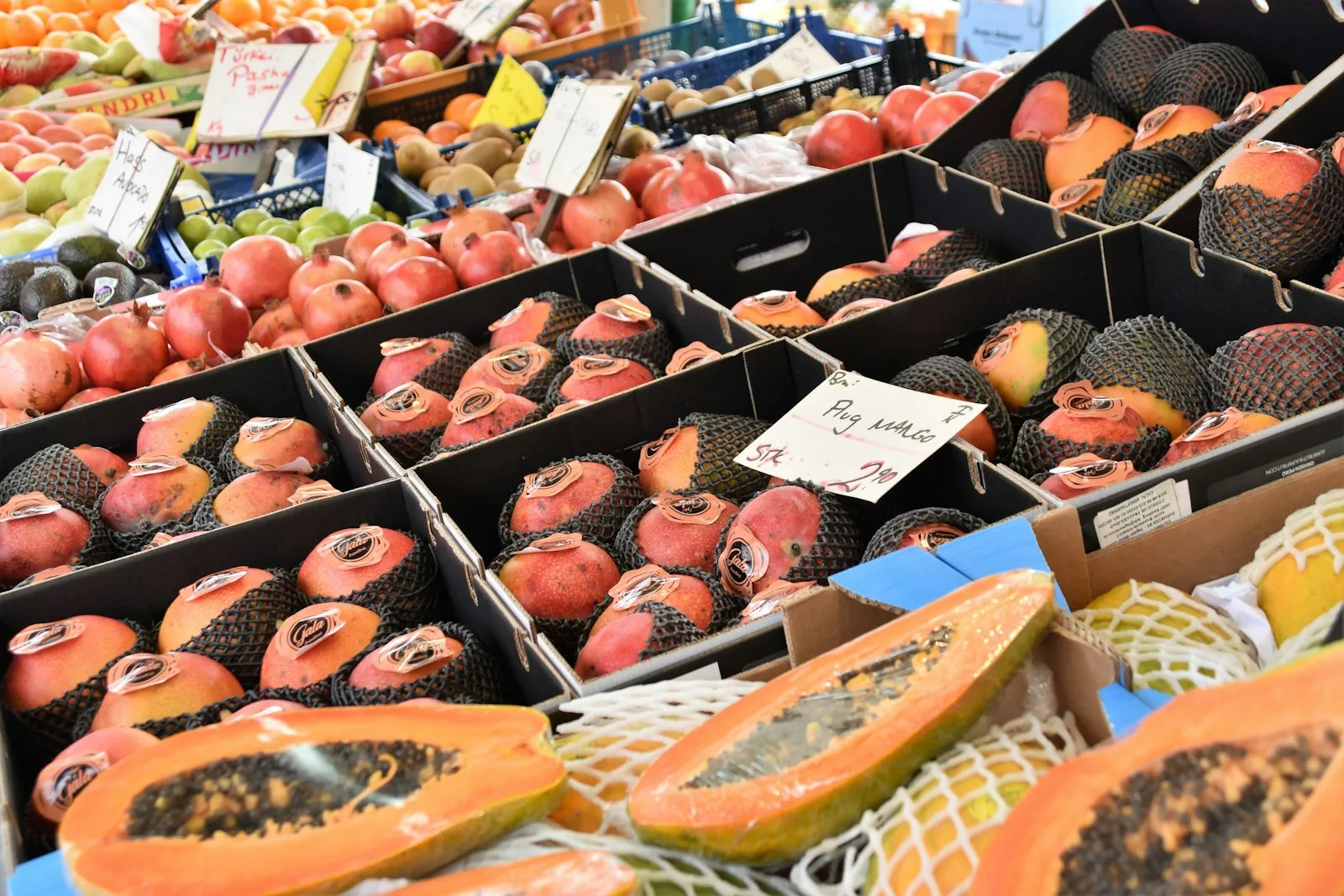 A variety of fresh fruits at a market stall