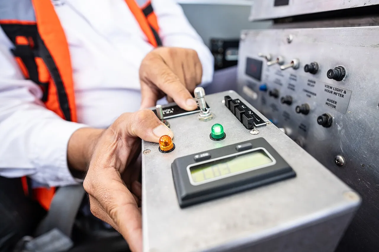 A technician inside a plane starts the machine that sends sterile screwworm flies out a chute over Texas