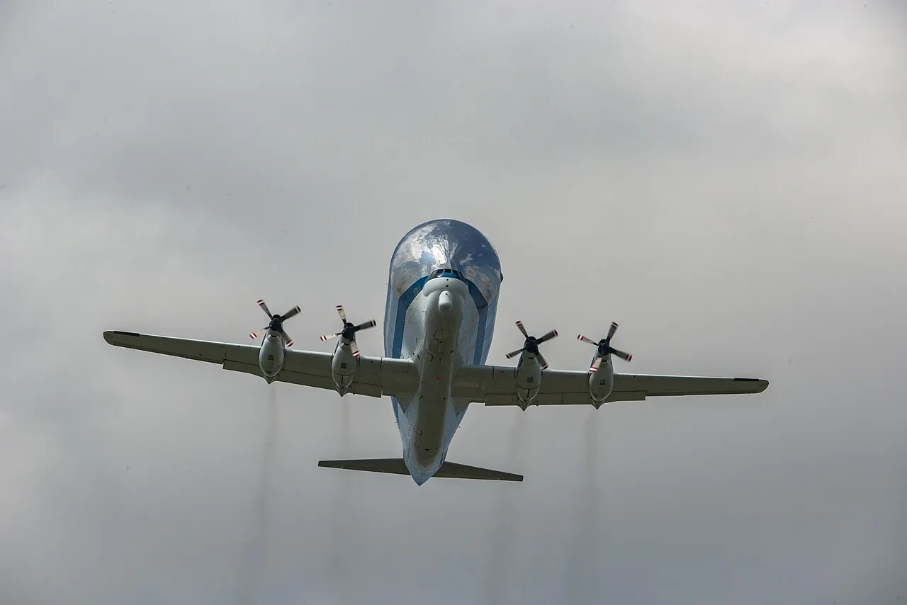 The Super Guppy flies overhead with its wheels down as it comes in to land in Huntsville, Alabama