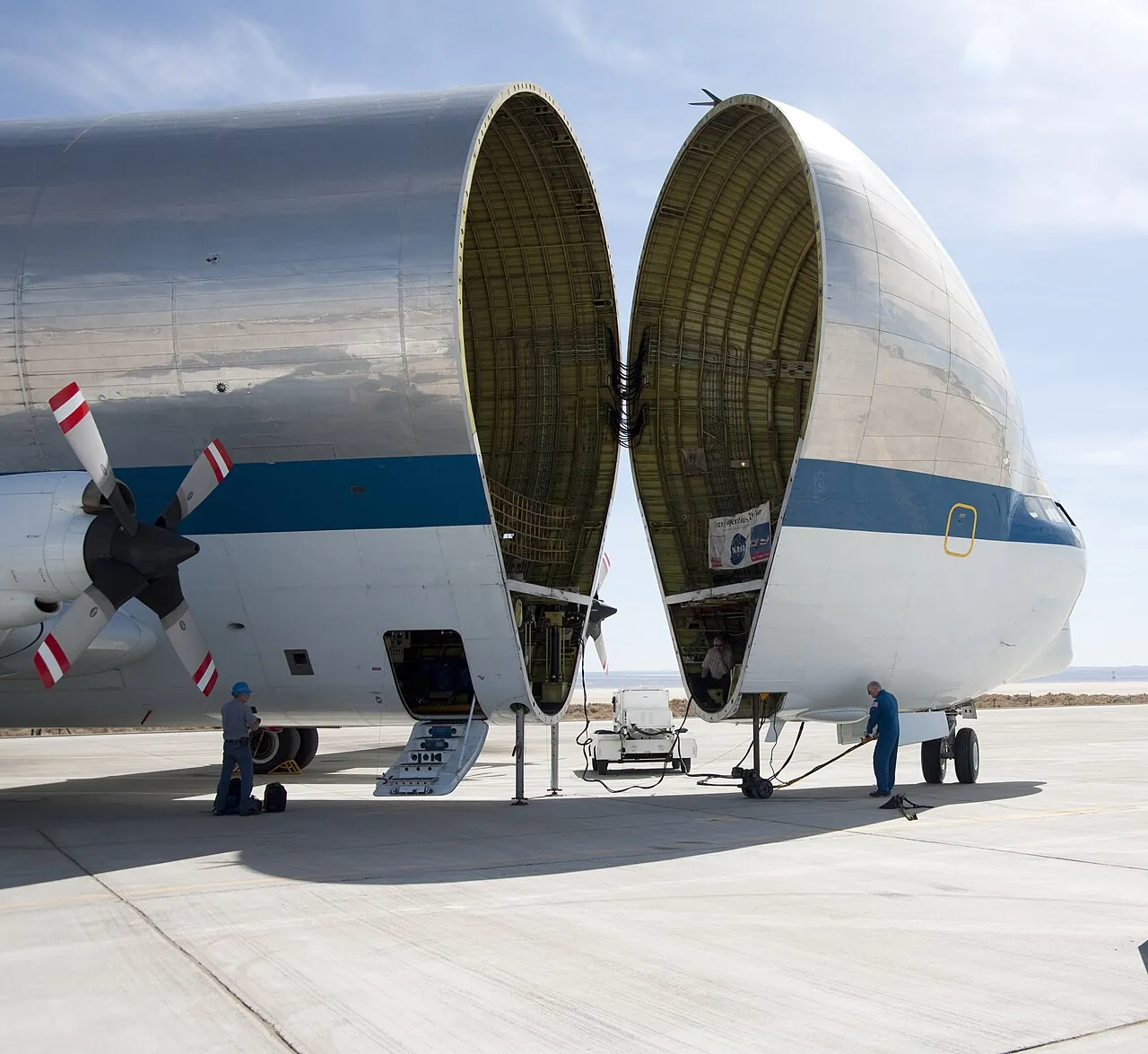 The Super Guppy swings its whole nose open on the ramp at NASA's Dryden Flight Research Center