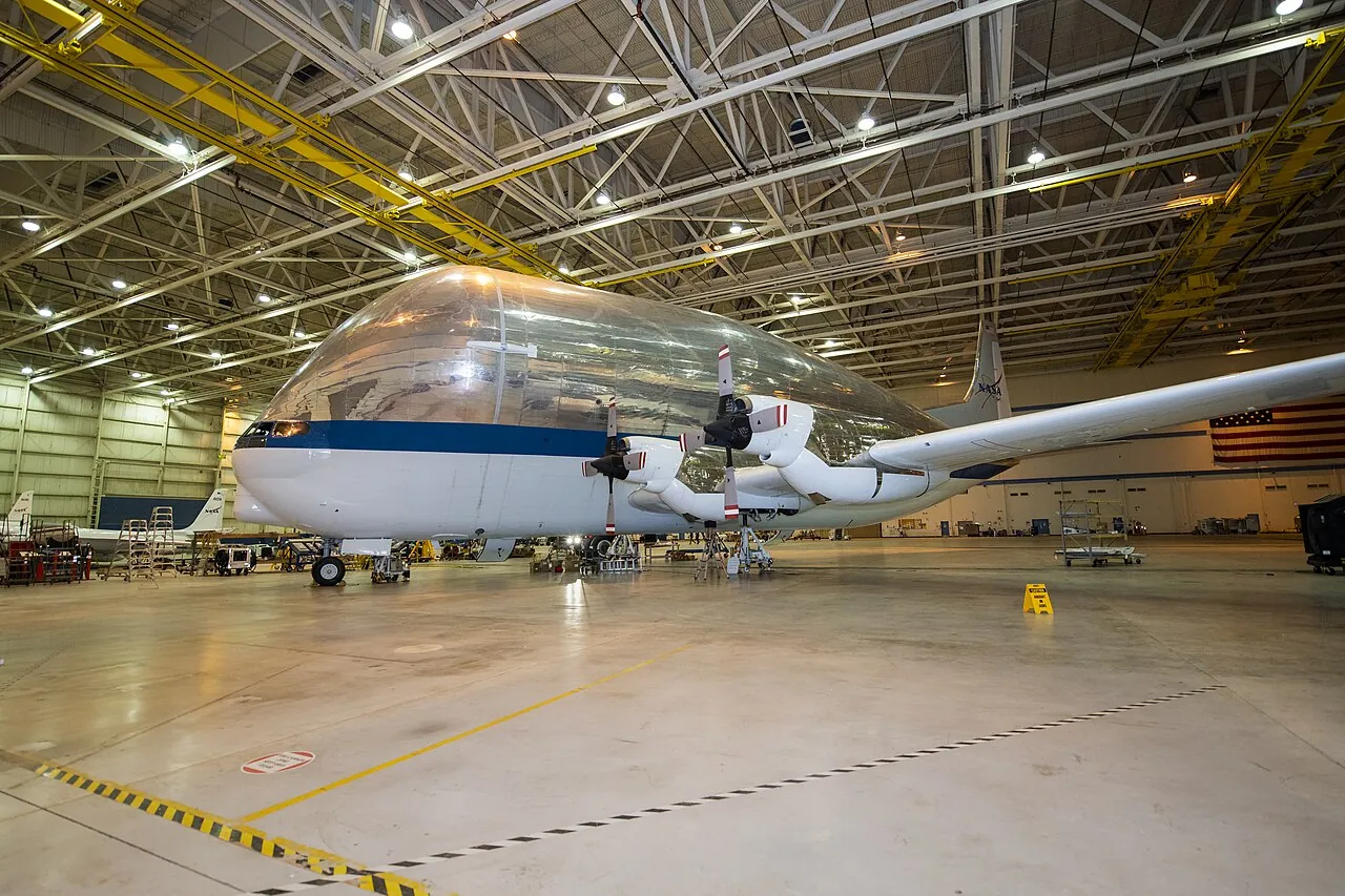 The Super Guppy parked inside a NASA hangar in Palmdale, California, for routine maintenance
