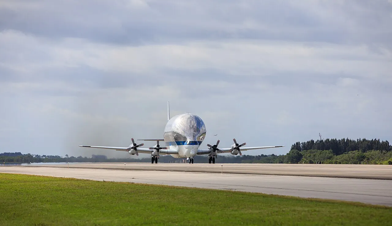The Super Guppy lifts off from Kennedy Space Center carrying a space station cargo module