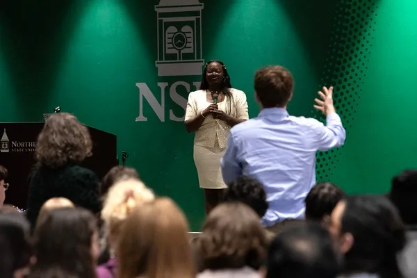 A student in the audience asking Dr. Raven a question