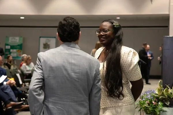 Dr. Raven talking with a teacher after a talk